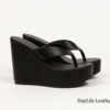 DayLife Leather Premium Black Platform Wedge Sandals Close-up shot of DayLife Leather black platform wedge sandals with thong-style straps, displayed on a clean white background, showcasing premium craftsmanship available at DayLifeLeather.com.
