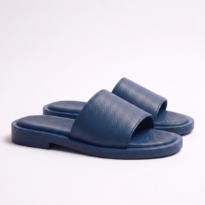 Top view of a pair of men's blue textured leather slippers, comfortable flat slide chappal for daily wear.