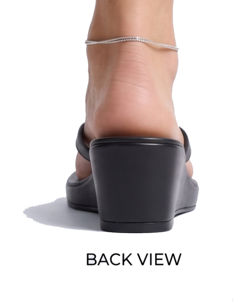 Woman wearing black leather Valentino wedge sandals: detailed product views including front, back, side, and top with Valentino branding.