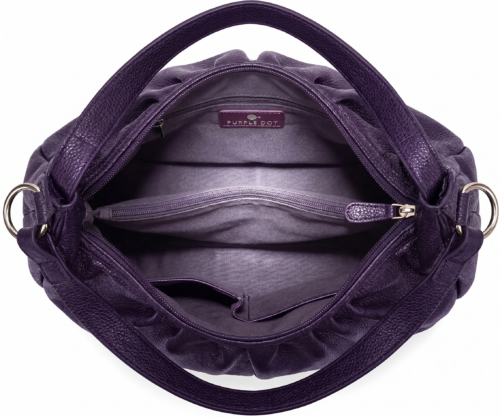 Side profile of Daylife Leather vibrant purple ruched slouchy hobo bag standing on a rustic wooden table.