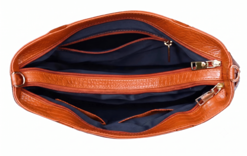 Inside view of an organized leather office bag showing multiple zippered dividers, deep inner lining, and spacious slots.