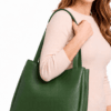 Inside view of green leather tote bag showing zip pocket and lining