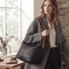 Black leather hobo shoulder bag with brown adjustable strap