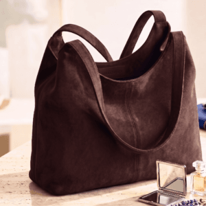 Brown Leather Hobo Bag – DayLife Leather Brown leather hobo bag styled with perfume and mirror on vanity