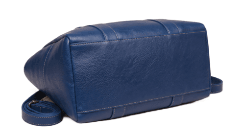 Bottom angle view of structured navy blue leather tote bag showing durable stitching and wide base. Bottom angle view of structured navy blue leather tote bag showing durable stitching and wide base.