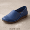 Men's navy blue pebbled leather slip-on shoes with beige ribbed sock-style collar and brown rubber sole