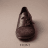 Dark brown leather and suede lace-up shoes for women, close-up texture view