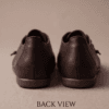 Dark brown leather and suede lace-up shoes for women, close-up texture view