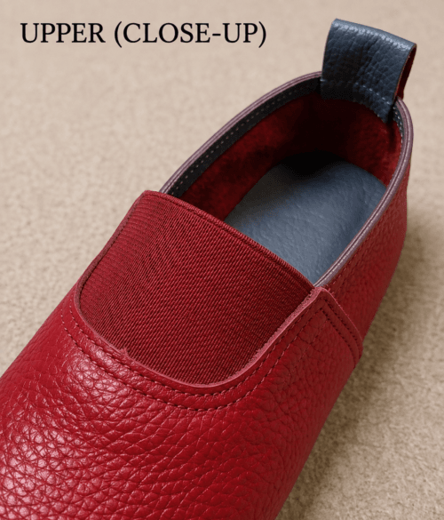 Maroon Genuine Leather Slip-On Loafers for Women Woman wearing maroon genuine leather slip-on loafers with cream trousers