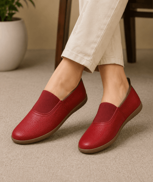 Maroon Genuine Leather Slip-On Loafers for Women Woman wearing maroon genuine leather slip-on loafers with cream trousers