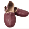 Men's maroon leather juti slip-on shoes with beige piping and suede-lined interior, side view