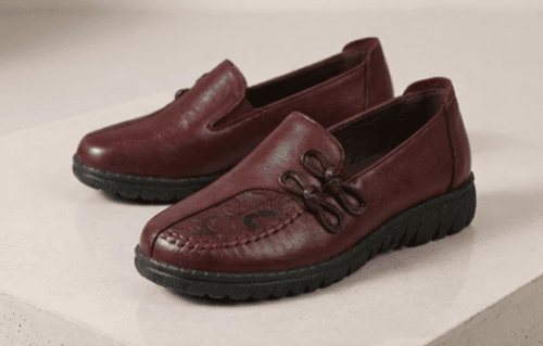 Top view of men's burgundy leather loafers with handcrafted knotted bow detail