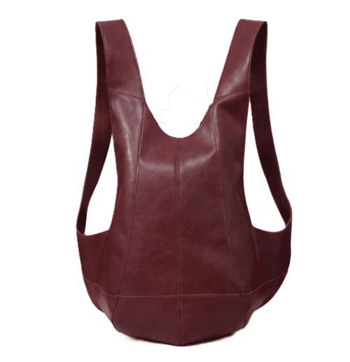 DayLife Leather handcrafted maroon ergonomic leather backpack worn by a female model on an urban street