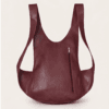 DayLife Leather handcrafted maroon ergonomic leather backpack worn by a female model on an urban street