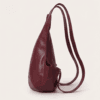 DayLife Leather handcrafted maroon ergonomic leather backpack worn by a female model on an urban street
