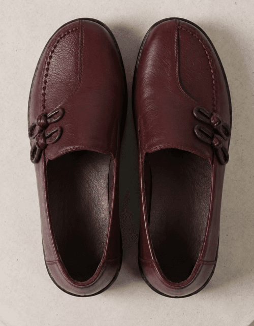 Top view of men's burgundy leather loafers with handcrafted knotted bow detail